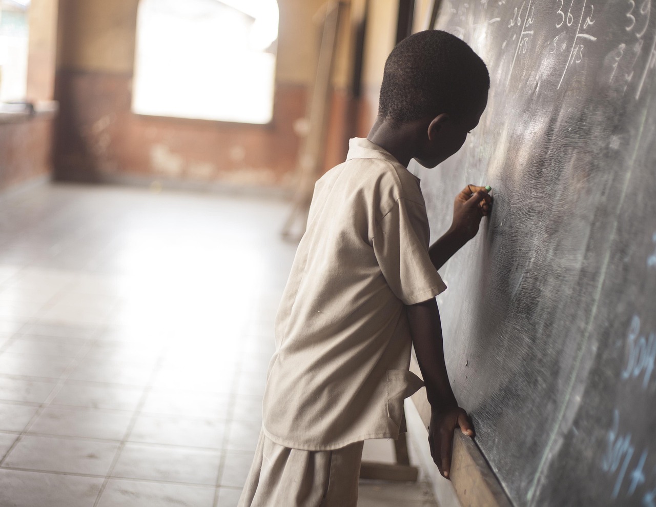 Boy writing, education, young — Slot Online Features You Should Always Try